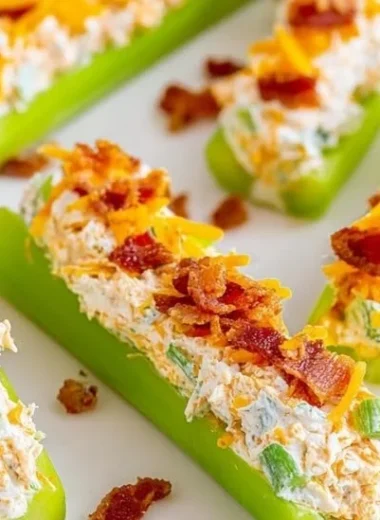 Cheddar bacon ranch stuffed celery sticks on a platter