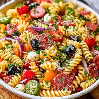Bowl of easy Italian pasta salad with fresh vegetables and dressing