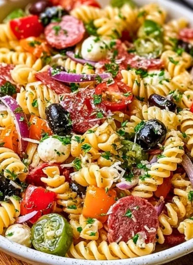 Bowl of easy Italian pasta salad with fresh vegetables and dressing