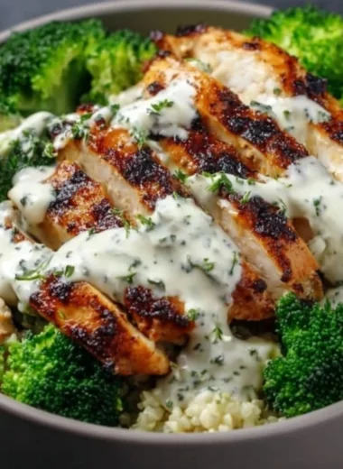 Healthy grilled chicken broccoli bowls with creamy garlic sauce
