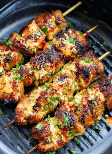 Delicious Air Fryer Bang Bang Chicken Skewers served with dipping sauce