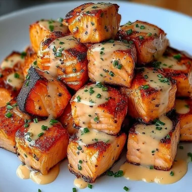 Crispy Bang Bang Salmon Bites served with a spicy dipping sauce