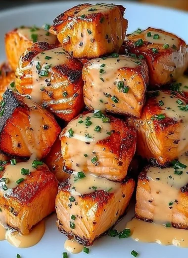 Crispy Bang Bang Salmon Bites served with a spicy dipping sauce