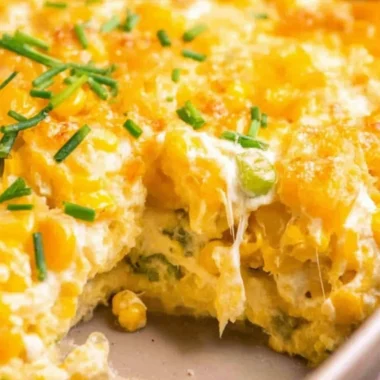 Delicious cream cheese corn casserole served in a dish.