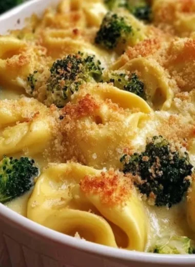 Creamy cheesy broccoli tortellini bake topped with melted cheese and baked to perfection.