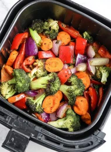 Bowl of easy air fryer roasted vegetables with vibrant colors and spices