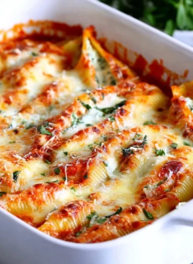 Easy stuffed shells filled with cheese and herbs on a serving plate