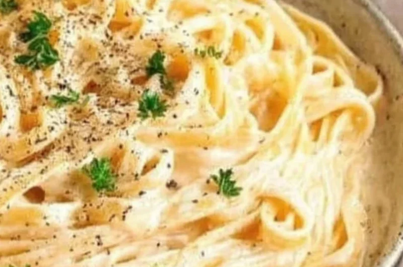 Creamy Fettuccine Alfredo pasta with Parmesan cheese and parsley garnish