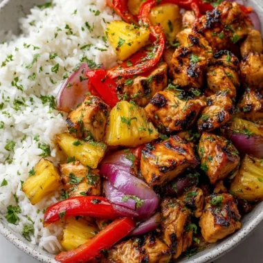 Hawaiian Chicken Sheet Pan with colorful vegetables and pineapple