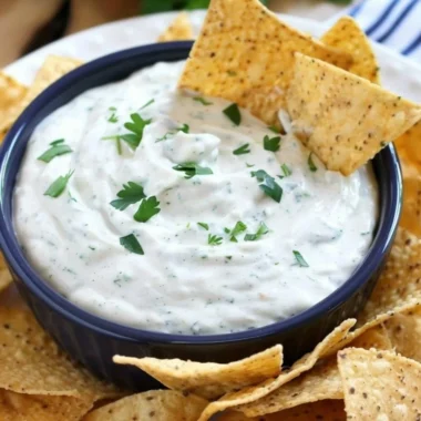 Bowl of homemade ranch dip with fresh vegetables for dipping