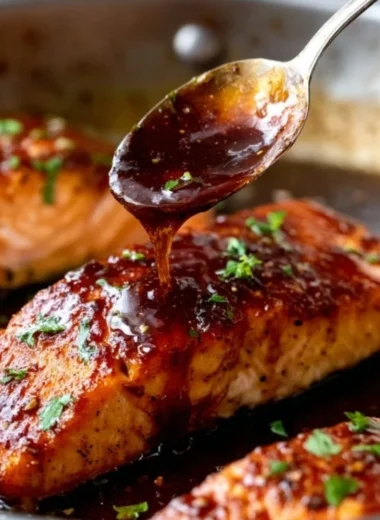 Honey Garlic Salmon dish garnished with herbs on a plate