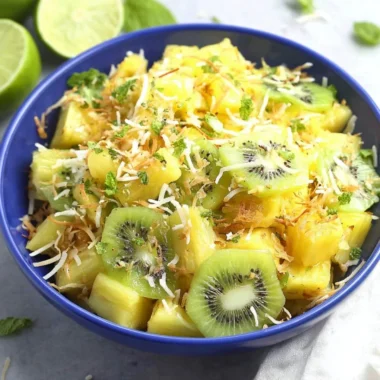 Delicious pineapple kiwi salad with fresh fruits in a bowl