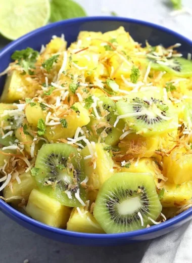 Delicious pineapple kiwi salad with fresh fruits in a bowl