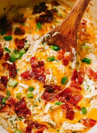 Delicious slow cooker crack chicken with creamy sauce served on a plate