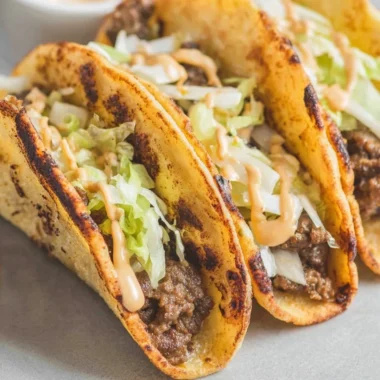 Smash Burger Tacos with juicy beef patties and fresh toppings served in soft tortillas