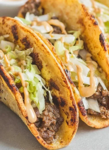 Smash Burger Tacos with juicy beef patties and fresh toppings served in soft tortillas