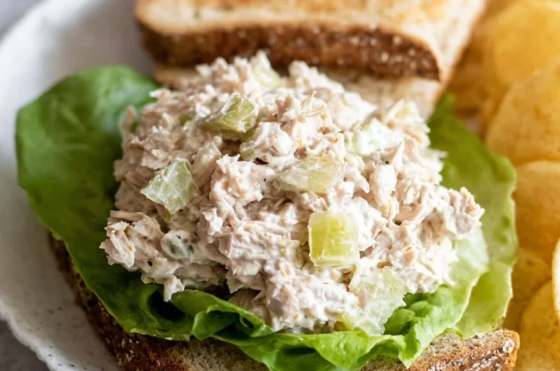 Delicious tuna salad sandwich with fresh ingredients and vibrant presentation.