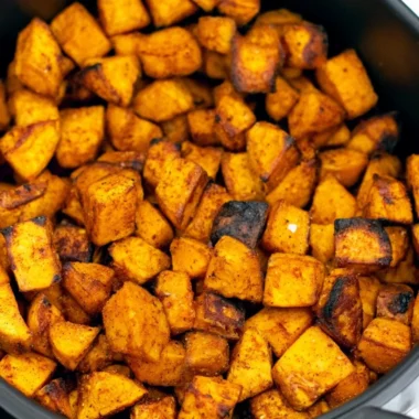 Crispy air fryer sweet potato cubes served in a bowl
