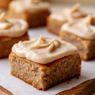 Delicious banana bread brownies on a plate with chocolate drizzle