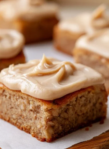 Delicious banana bread brownies on a plate with chocolate drizzle