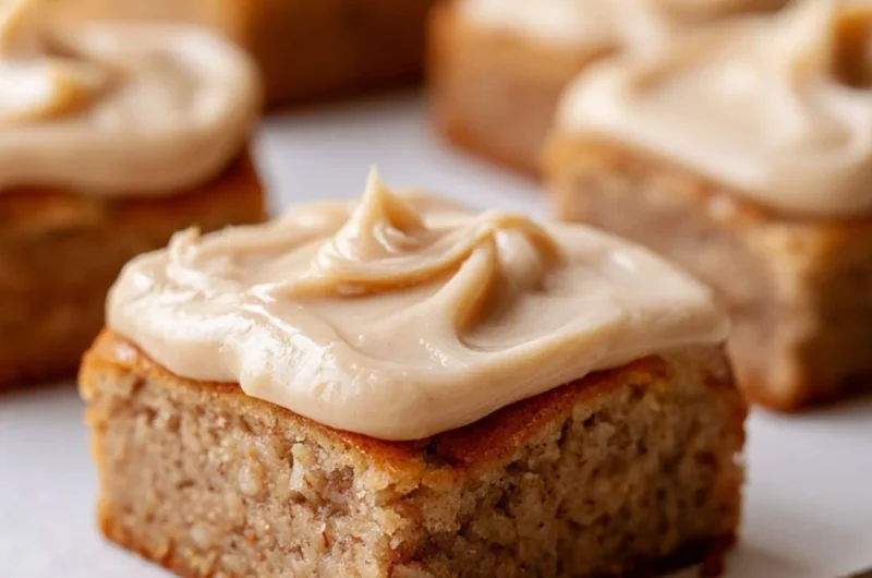 Delicious banana bread brownies on a plate with chocolate drizzle