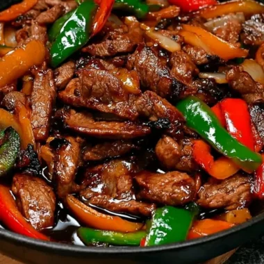 Chinese pepper steak with onions served in a vibrant bowl