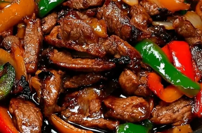 Chinese pepper steak with onions served in a vibrant bowl