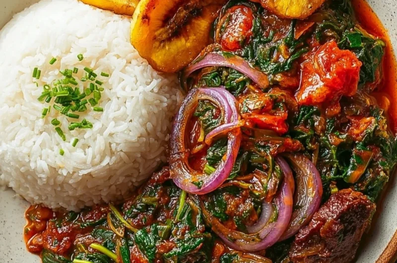 A bowl of Ghanaian Spinach Stew garnished with herbs and spices.