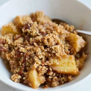 Healthy breakfast apple crumble topped with oats and fresh apples