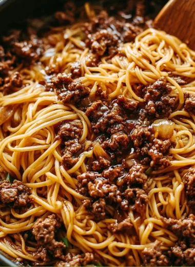 Delicious Mongolian ground beef noodles served in a bowl with colorful vegetables
