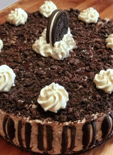 Oreo Easy Ice Cream Cake served with chocolate drizzle and crushed cookies