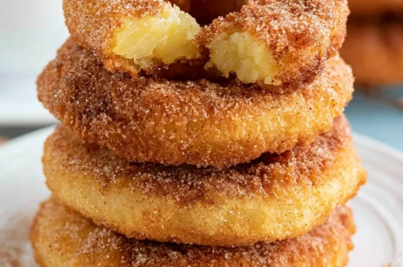 Crispy pineapple fritter rings served on a plate