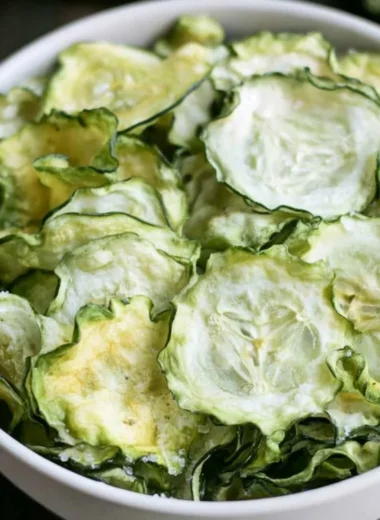 Crispy homemade salt and vinegar cucumber chips served in a bowl