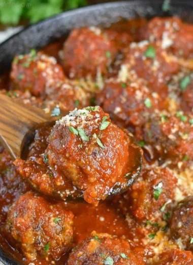Delicious Italian meatballs served with marinara sauce and spaghetti