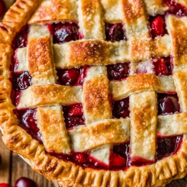 Freshly baked ultimate cherry pie with a golden crust and vibrant cherry filling