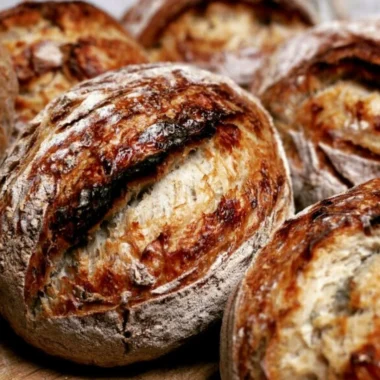 Freshly baked sourdough bread with a crispy crust and soft interior.