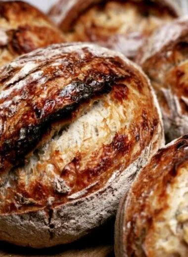 Freshly baked sourdough bread with a crispy crust and soft interior.