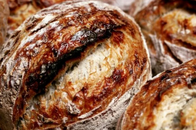 Freshly baked sourdough bread with a crispy crust and soft interior.