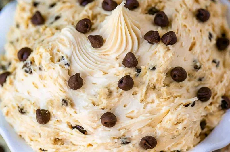 Bowl of chocolate chip cookie dough dip with chocolate chips on top