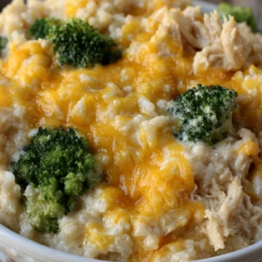Cozy cheesy broccoli chicken rice casserole served in a baking dish