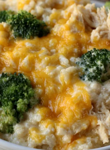 Cozy cheesy broccoli chicken rice casserole served in a baking dish