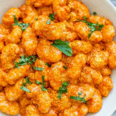 Cozy gnocchi served with garlic cream tomato sauce in a bowl
