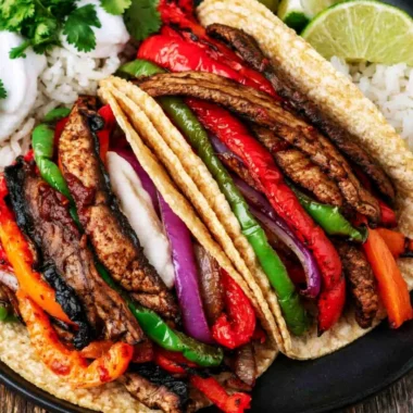 Delicious Cozy Portobello Vegan Fajitas served with fresh vegetables and spices