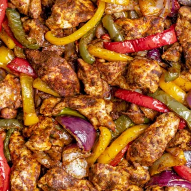 Cozy sheet pan chicken fajitas served with colorful vegetables