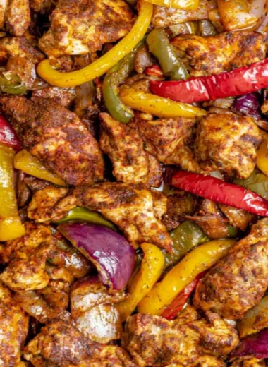 Cozy sheet pan chicken fajitas served with colorful vegetables