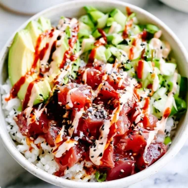 Cozy spicy tuna poke bowl with fresh ingredients and spicy sauce