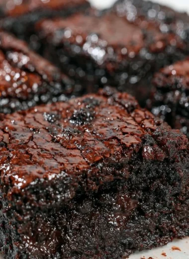 Delicious easy sourdough brownies topped with chocolate and nuts