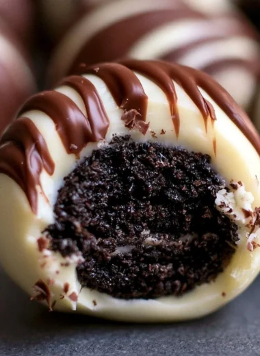 Delicious Irish Cream Oreo truffles on a plate garnished with chocolate shavings.
